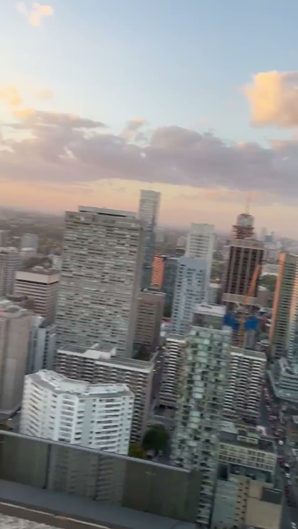 Walking across a rooftop, phone in hand